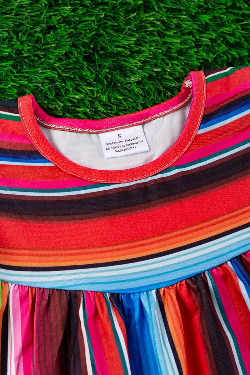 SERAPE PRINTED TUNIC WITH BLACK POM POM TRIM