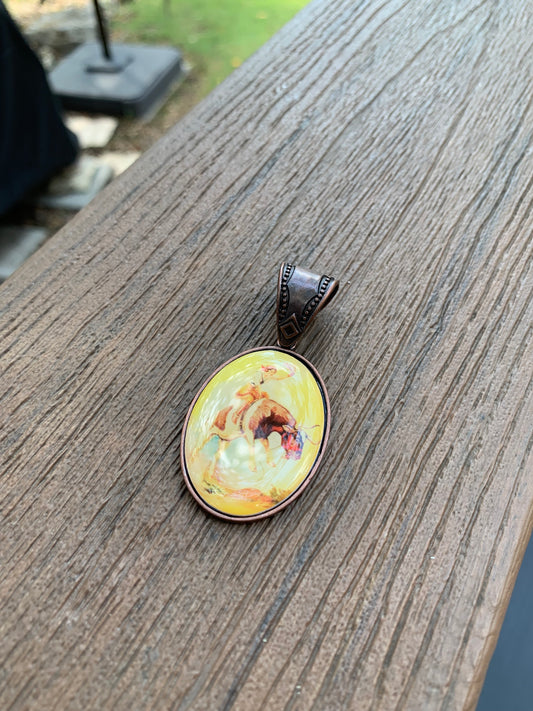 metal oval cowgirl pendent