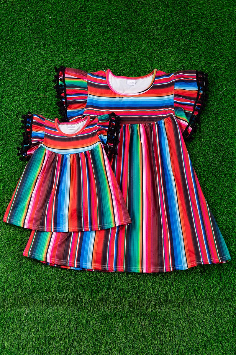SERAPE PRINTED TUNIC WITH BLACK POM POM TRIM
